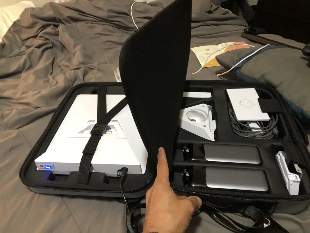 Customer case containing Mini, the attached Ennzia battery and their travel accessories